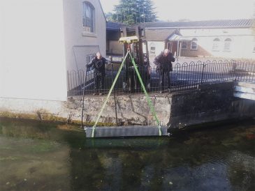 3 panel FireFlo assembly being lowered into the watercourse